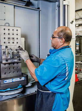Machinist operating a CNC milling machine