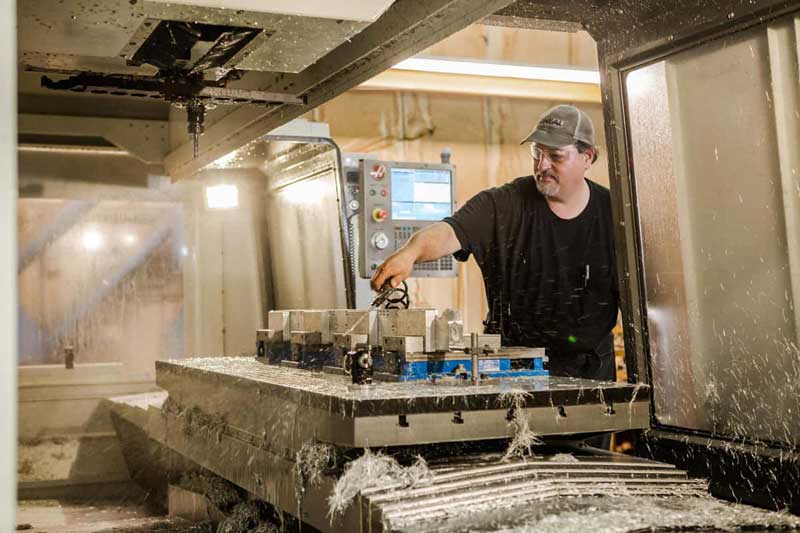 Machinist operating a CNC milling center