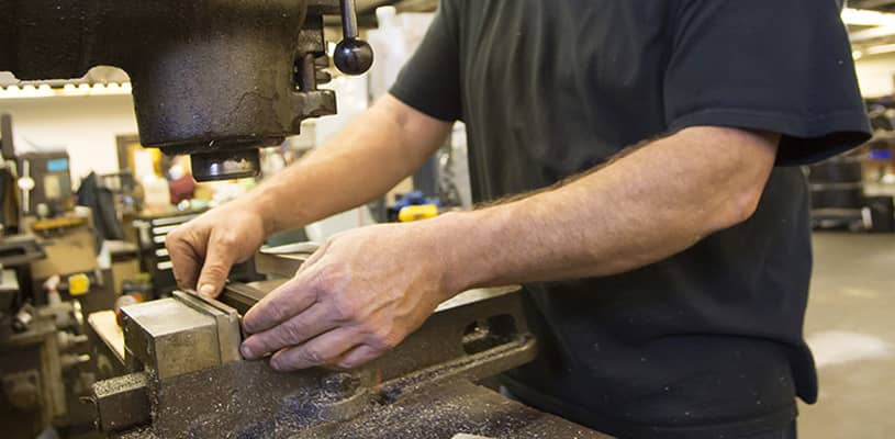 Machinist setting up machine for low-volume run